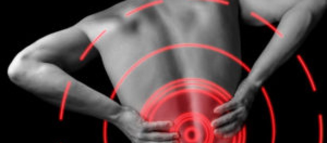 32971296 - acute pain in a male lower back, monochrome  image, pain area of red color